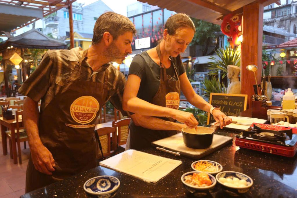 Hands-on culinary session at Madam Thu Restaurant mastering authentic Hue imperial recipes with expert chefs. Master the delicate art of Hue cuisine during our interactive, professional hands-on cooking workshop.