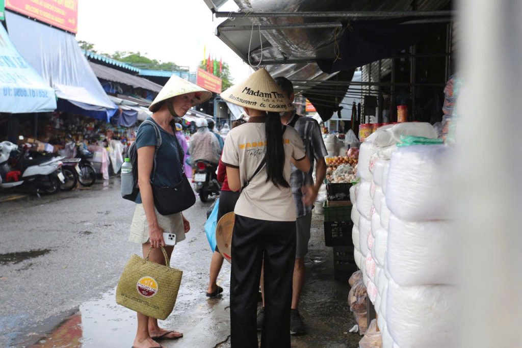 Guided Dong Ba Market tour selecting fresh local ingredients for an authentic Hue cooking class. Immerse yourself in the vibrant colors and aromas of Hue’s historic Dong Ba Market.
