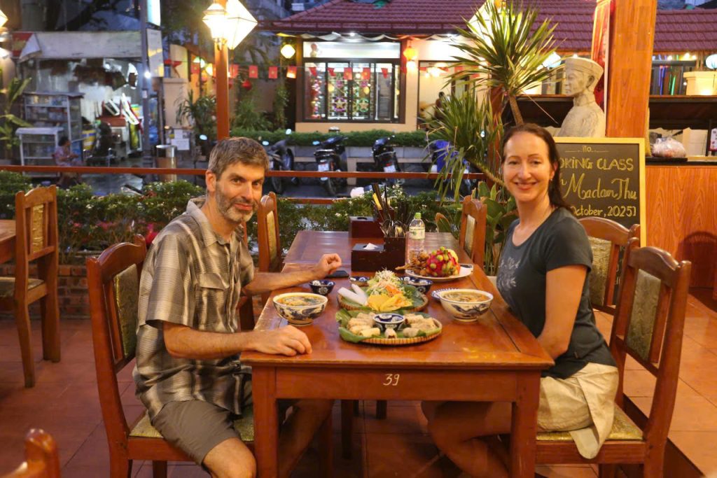 Guests enjoying a private feast and receiving cooking certificates after their Hue culinary workshop. Celebrate your new skills with a delicious feast and an official Hue cooking certificate.