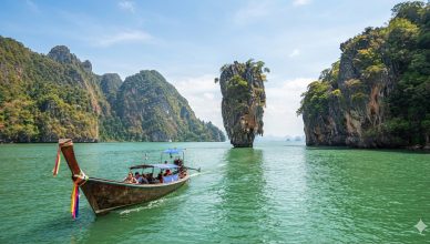 Phang Nga Bay & James Bond Island Tour: Private Shore Excursion from Phuket Port 3 Traditional long tail boat sailing near James Bond Island and limestone karsts in phang nga bay tour.