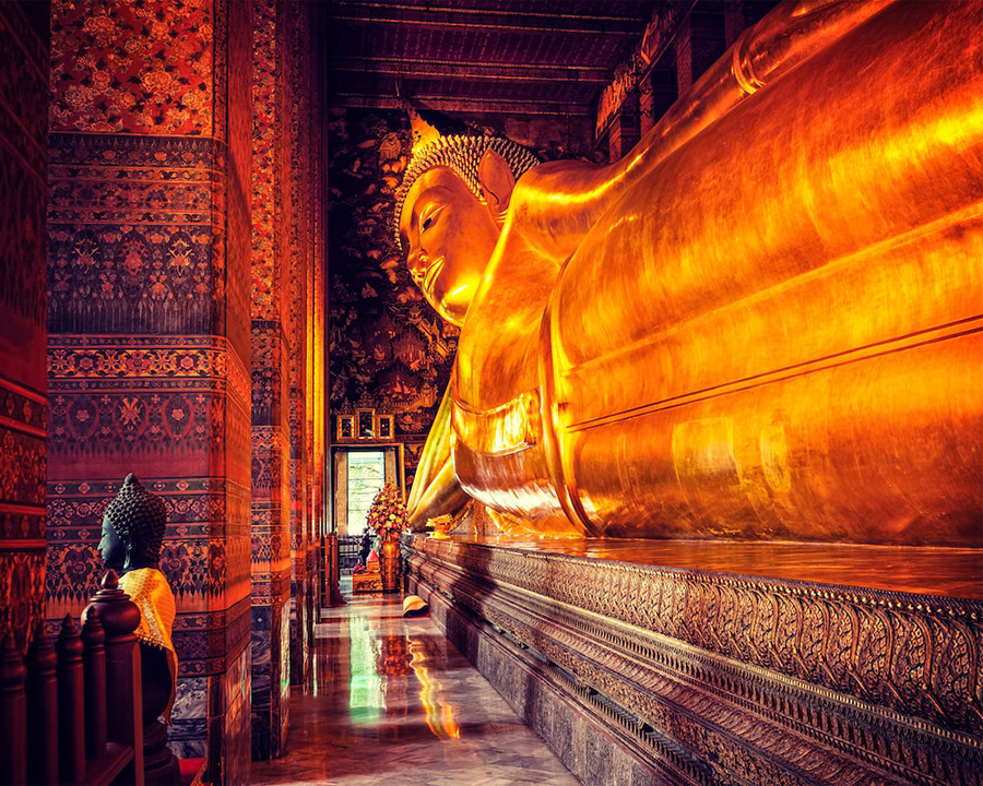 Admire the majestic 46-meter-long Reclining Buddha at Wat Pho, a key highlight of our private Bangkok Essential Highlights Tour. Reclining Buddha at Wat Pho during Bangkok Essential Highlights Tour