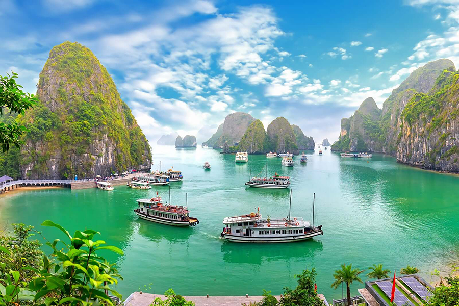Cruise Halong Bay’s UNESCO wonders: emerald waters, majestic karsts, pure luxury. along Bay, Vietnam: UNESCO limestone karsts in emerald waters, featured on luxury tours.
