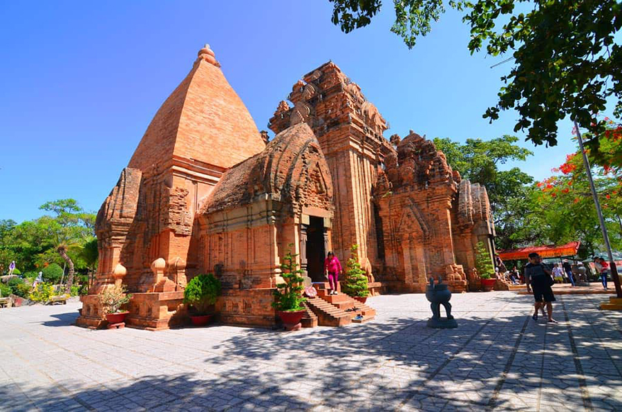 Ancient red brick Po Nagar Cham Towers in Nha Trang, Vietnam, featuring intricate Champa architecture sculptures  on Nha Trang Private City Tour.