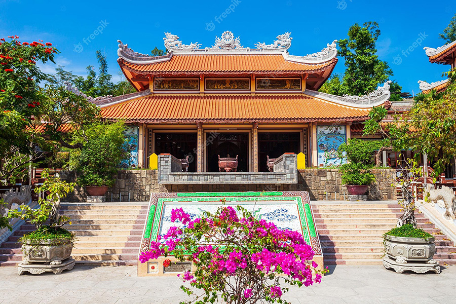 Intricate mosaic architecture and traditional temple rooftops at Long Son Pagoda overlooking Nha Trang city on Nha Trang Private City Tour.