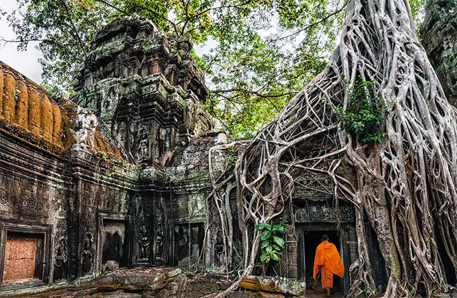 Angkor Thom, Cambodia: Discover Bayon’s iconic smiling faces and grand temples. Panoramic view of Angkor Thom's Bayon temple, Cambodia, on a Vietnam and Cambodia tour.