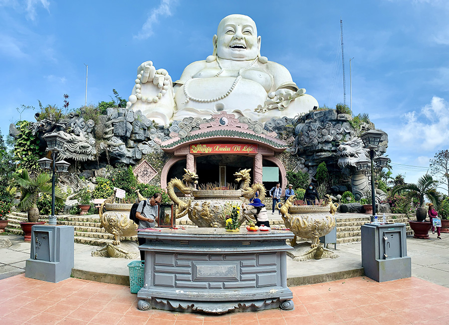Serene Buddha statue at Sam Mountain: Find peace in Vietnam’s spiritual landscape. Buddha statue on Sam Mountain, Vietnam, a tranquil stop on your Vietnam and Cambodia tour.