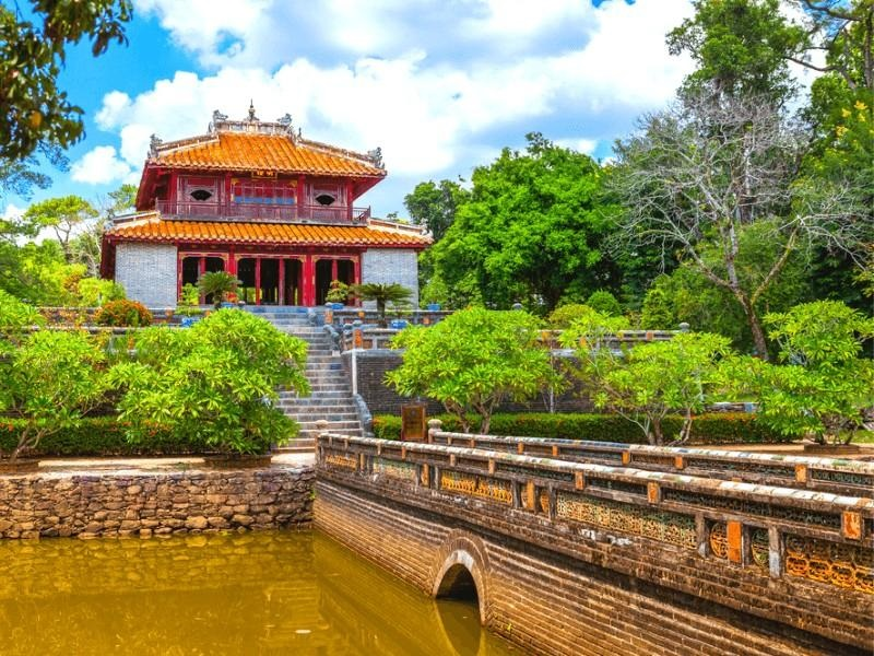 The harmonious blend of architecture and nature at Minh Mang Tomb. A wide view of Minh Mang Tomb's main lake and courtyards.