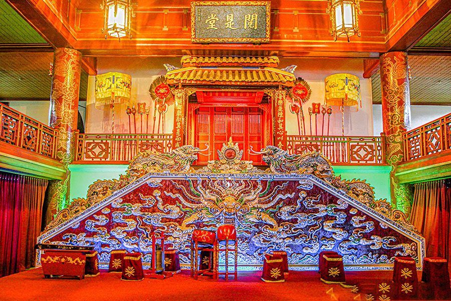 The Royal Theater: where emperors enjoyed traditional Vietnamese opera and music. The ornate interior stage and seating area of the Hue Royal Theater.
