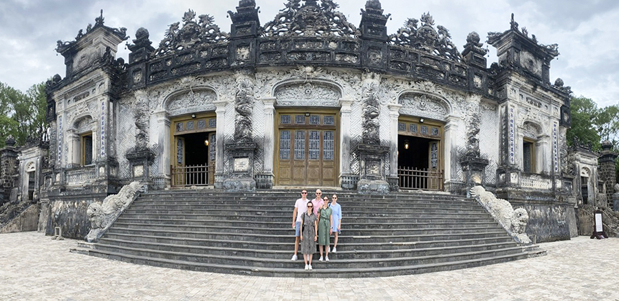 Customers marvel at the majestic fusion of Eastern and Western architecture at Khai Dinh Tomb. Visitors exploring the elaborate and ornate interior of Khai Dinh Tomb in Vietnam.