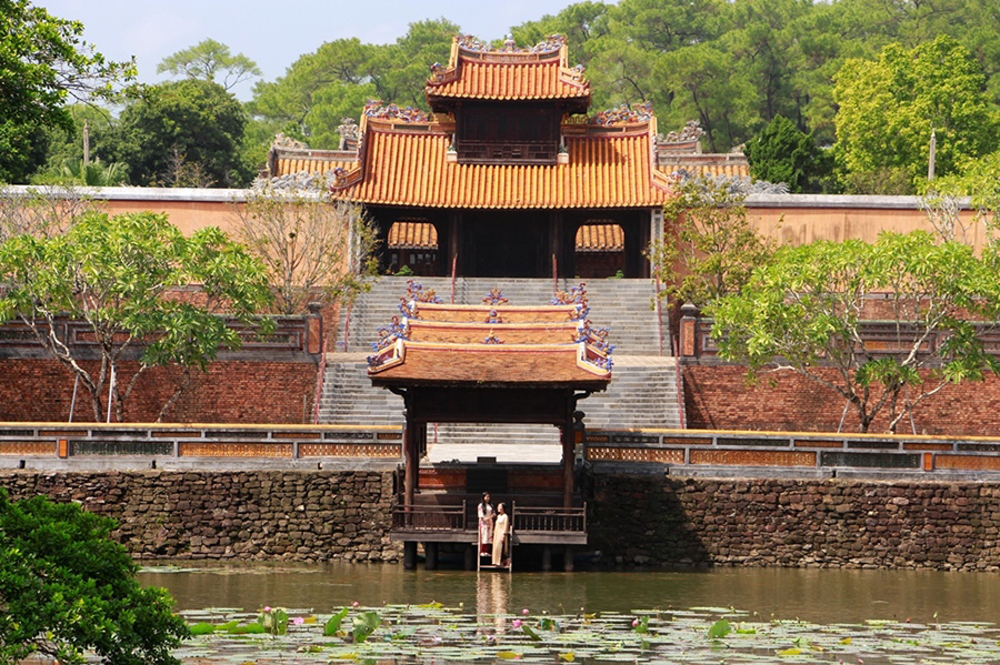 A serene view of Tu Duc Tomb’s peaceful lake and poetic landscape in Hue. A picturesque image of the tranquil lake at the royal Tu Duc Tomb.