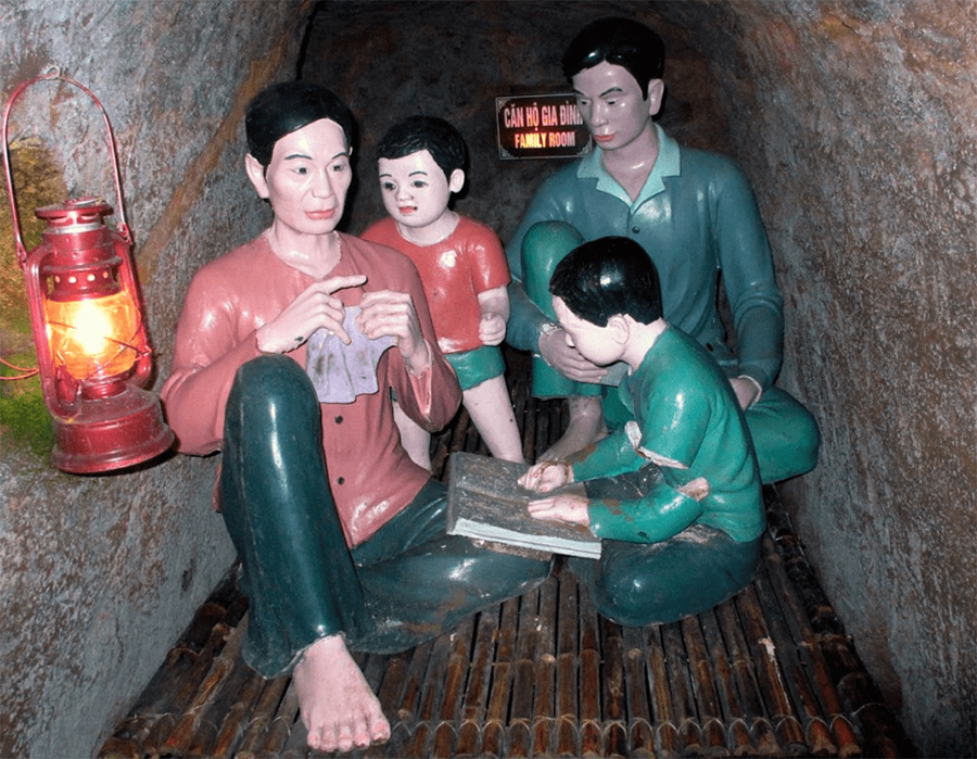 Journeying through the historic Vinh Moc Tunnels, a remarkable underground village where families lived. A photo showing the narrow, earthen passage inside the historic Vinh Moc Tunnels.