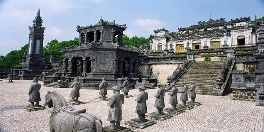 A majestic and ornate Khai Dinh Tomb in Hue, a key stop on the Hue tour. The exterior of the intricately decorated Khai Dinh Tomb, showcasing a unique blend of architectural styles.